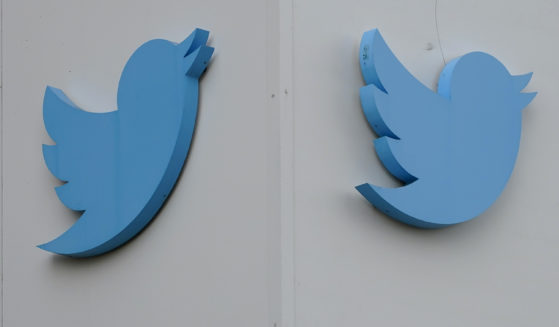 Twitter logos hang outside the company's offices in San Francisco in December. Ella Irwin, Twitter's head of trust and safety, has left the company.