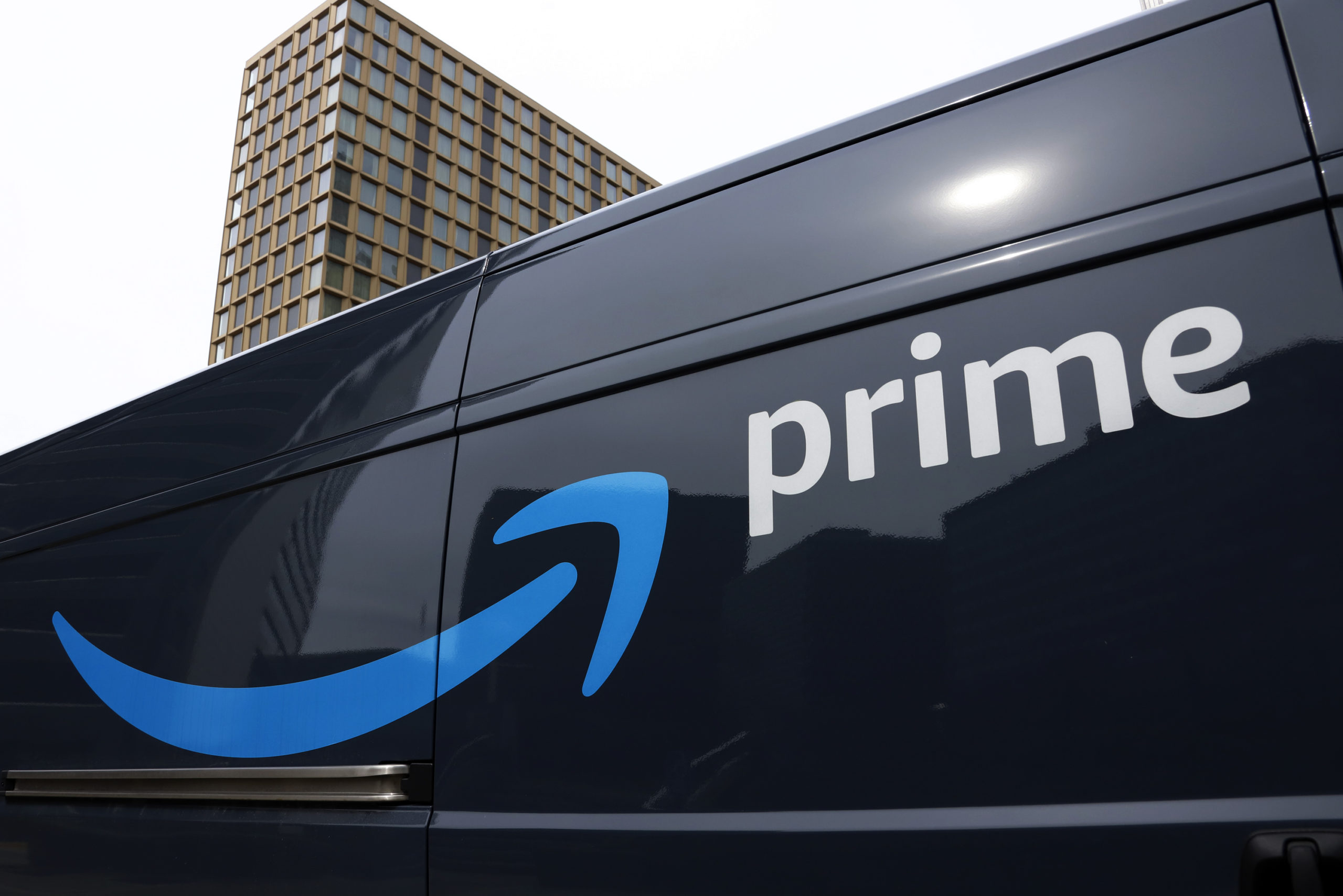 An Amazon Prime delivery vehicle is seen in downtown Pittsburgh in a file photo from March 2020. The Federal Trade Commission sued Amazon on Wednesday for what it called a years-long effort to enroll consumers without consent into its Prime program and making it difficult for them to cancel their subscriptions.