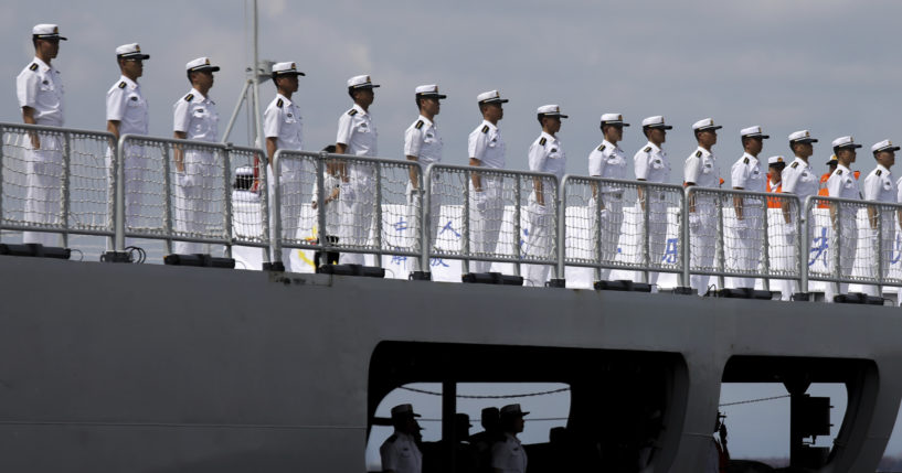 Chinese navy sailors stand in formation on board the naval training ship, Qi Jiguang, as it docks at Manila's port, Philippines in a file photo from June 14. China says its navy ships are preparing for joint exercises with Russia's sea forces in a sign of Beijing's continuing support for Moscow's invasion of neighboring Ukraine.