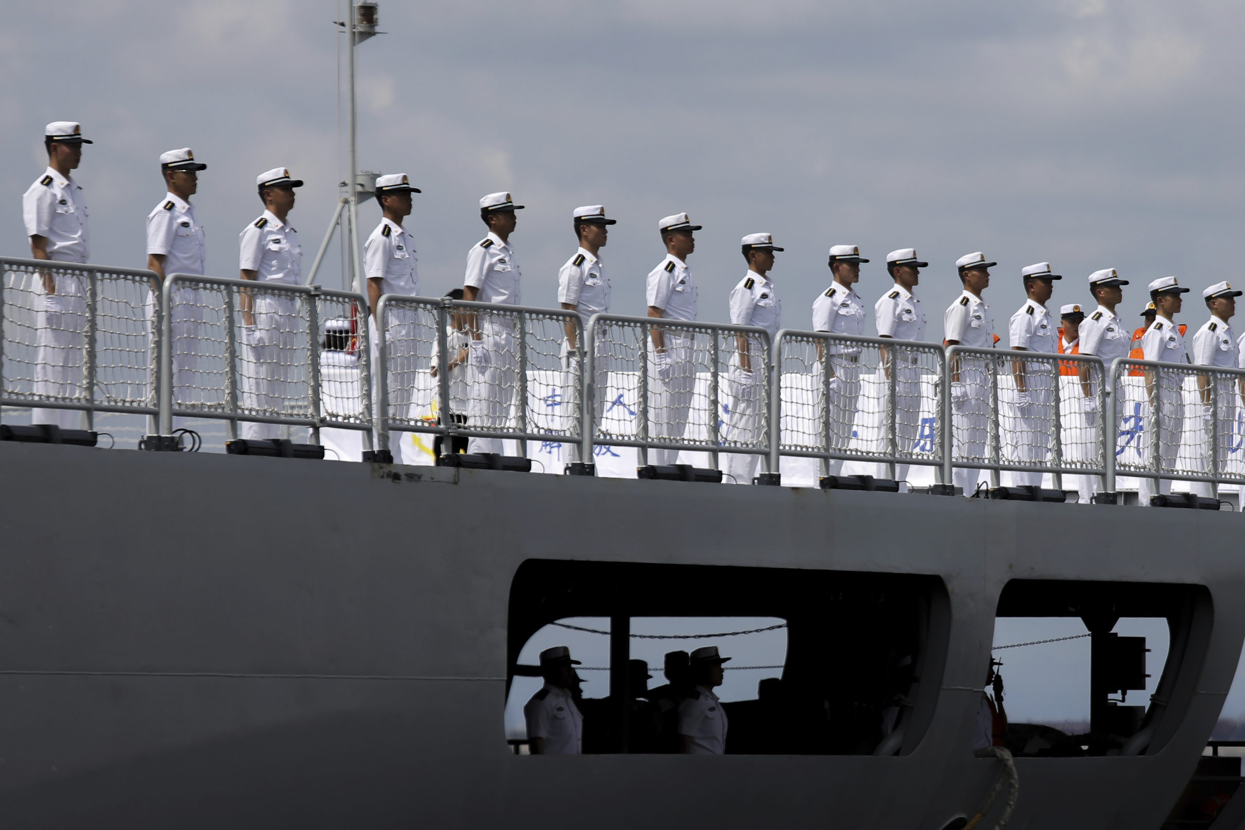 Chinese navy sailors stand in formation on board the naval training ship, Qi Jiguang, as it docks at Manila's port, Philippines in a file photo from June 14. China says its navy ships are preparing for joint exercises with Russia's sea forces in a sign of Beijing's continuing support for Moscow's invasion of neighboring Ukraine.