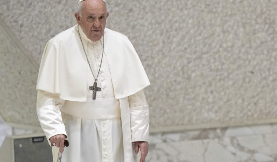 Pope Francis arrives for his weekly general audience in the Pope Paul VI hall at the Vatican on Wednesday.