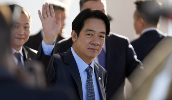 Taiwan's Vice President William Lai Ching-te waves after landing at Silvio Pettirossi airport in Luque, Paraguay, on Aug. 14. The Chinese military launched drills around Taiwan on Saturday as a "stern warning” over what it called collusion between “separatists and foreign forces” days after Lai stopped over in the United States.