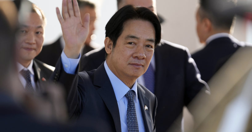 Taiwan's Vice President William Lai Ching-te waves after landing at Silvio Pettirossi airport in Luque, Paraguay, on Aug. 14. The Chinese military launched drills around Taiwan on Saturday as a "stern warning” over what it called collusion between “separatists and foreign forces” days after Lai stopped over in the United States.