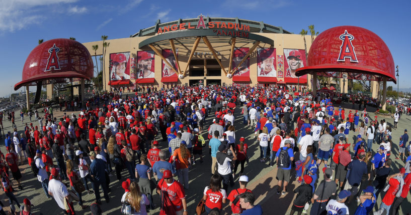 Fans line up outside Angel Stadium in Anaheim, California, for an opening day baseball game between the Los Angeles Angels and the Chicago Cubs on April 4, 2016.