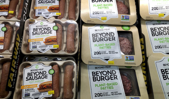 Packages of Beyond Meat's Beyond Burgers and Beyond Sausage are pictured in a New York City store on April 29, 2021.