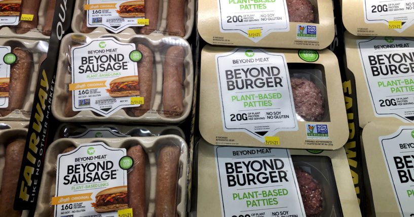 Packages of Beyond Meat's Beyond Burgers and Beyond Sausage are pictured in a New York City store on April 29, 2021.