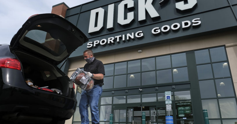 Gus Promollo puts an order in a customer’s trunk at Dick’s Sporting Goods in Paramus, New Jersey on May 18, 2020. Dick’s Sporting Goods profit slipped in its second quarter and missed Wall Street’s expectations as the retailer cut its full-year profit outlook, citing worries over theft at its stores.