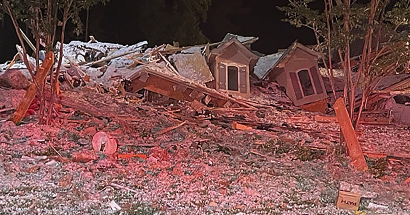 This photo taken early Tuesday morning in Mooresville, North Carolina, shows the rubble of a home that collapsed. Iredell County Emergency Management said in a Tuesday news release that emergency officials responded to the home after a reported explosion and collapse and that one person was injured and another person was found dead in the debris.