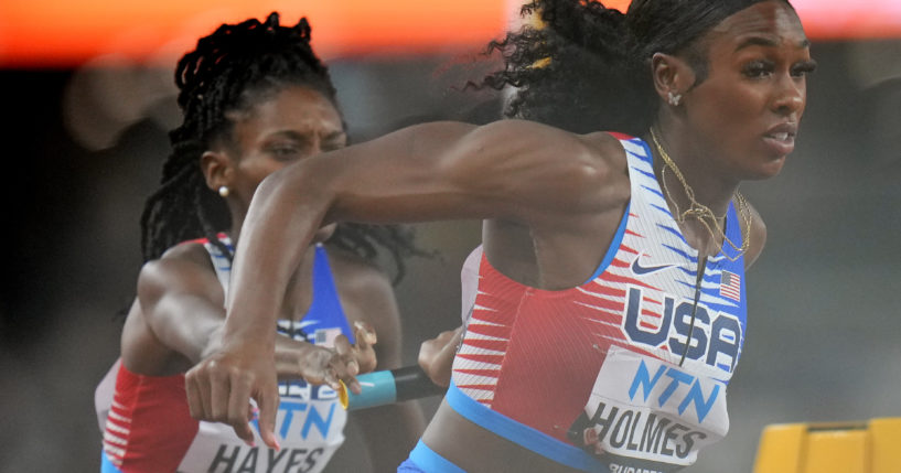 U.S. runners Alexis Holmes and Quanera Hayes fail to make the final baton exchange in a women's 4x400-meter relay heat Saturday during the World Championships in track and field in Budapest, Hungary. The U.S. 4x400 team was disqualified during the event.