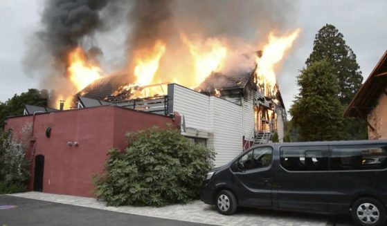 Fire rages at a vacation home in the town of Wintzenheim, north-eastern France, Wednesday Aug. 9, 2023. A fire ripped through a vacation home for adults with disabilities in eastern France on Wednesday, killing several people, the head of rescue operations said. (TNN / AP)