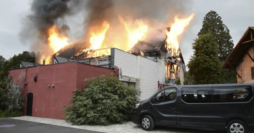 Fire rages at a vacation home in the town of Wintzenheim, north-eastern France, Wednesday Aug. 9, 2023. A fire ripped through a vacation home for adults with disabilities in eastern France on Wednesday, killing several people, the head of rescue operations said. (TNN / AP)