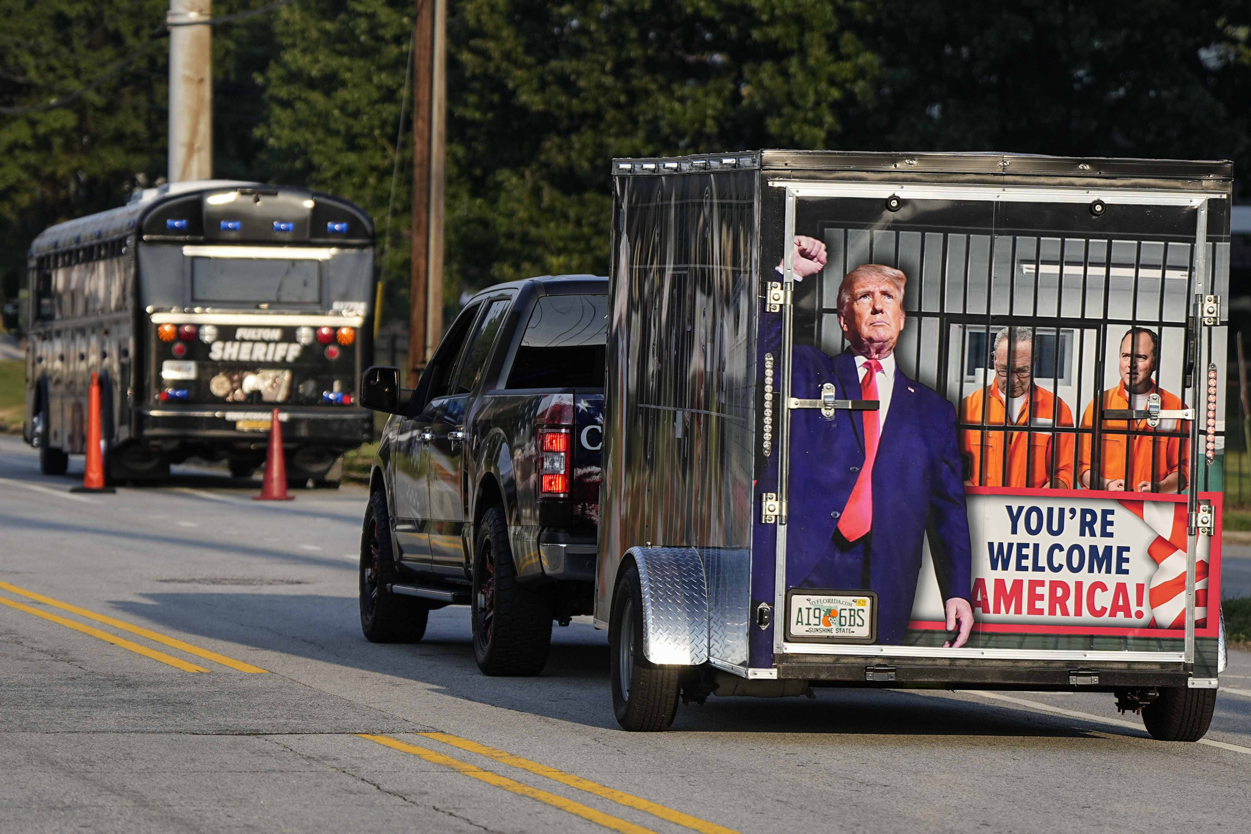 A vehicle and trailer pass the Fulton County Jail in Atlanta on Thursday.