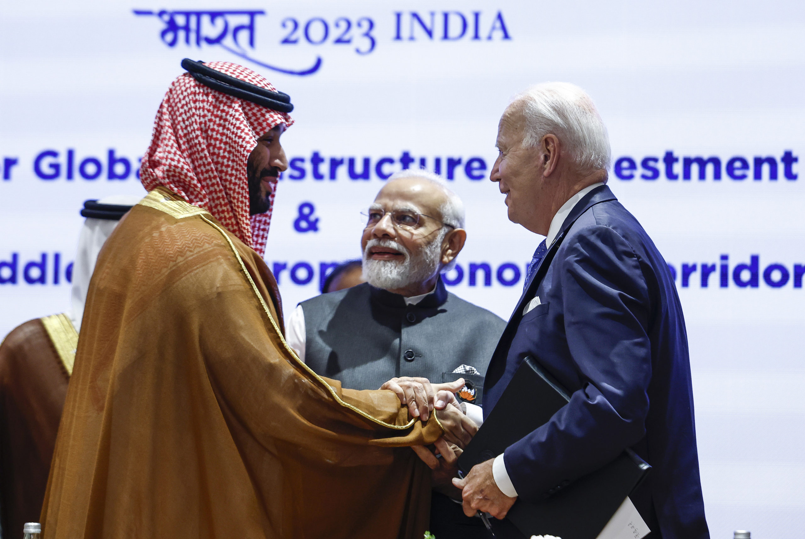 Saudi Arabian Crown Prince Mohammed bin Salman Al Saud, left, and President Joe Biden, right, shake hands next to Indian Prime Minister Narendra Modi at the G20 summit in New Delhi, India.