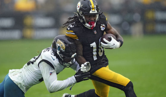 Pittsburgh Steelers wide receiver Diontae Johnson runs past Jacksonville Jaguars cornerback Darious Williams during the first half of Sunday's game in Pittsburgh, Pennsylvania.