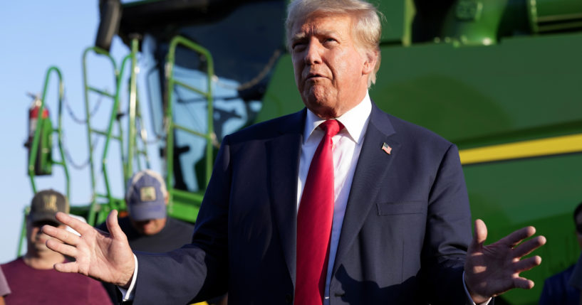 Former President Donald Trump speaks to reporters on Sunday during a visit to the Vande Voort family farm in Leighton, Iowa.