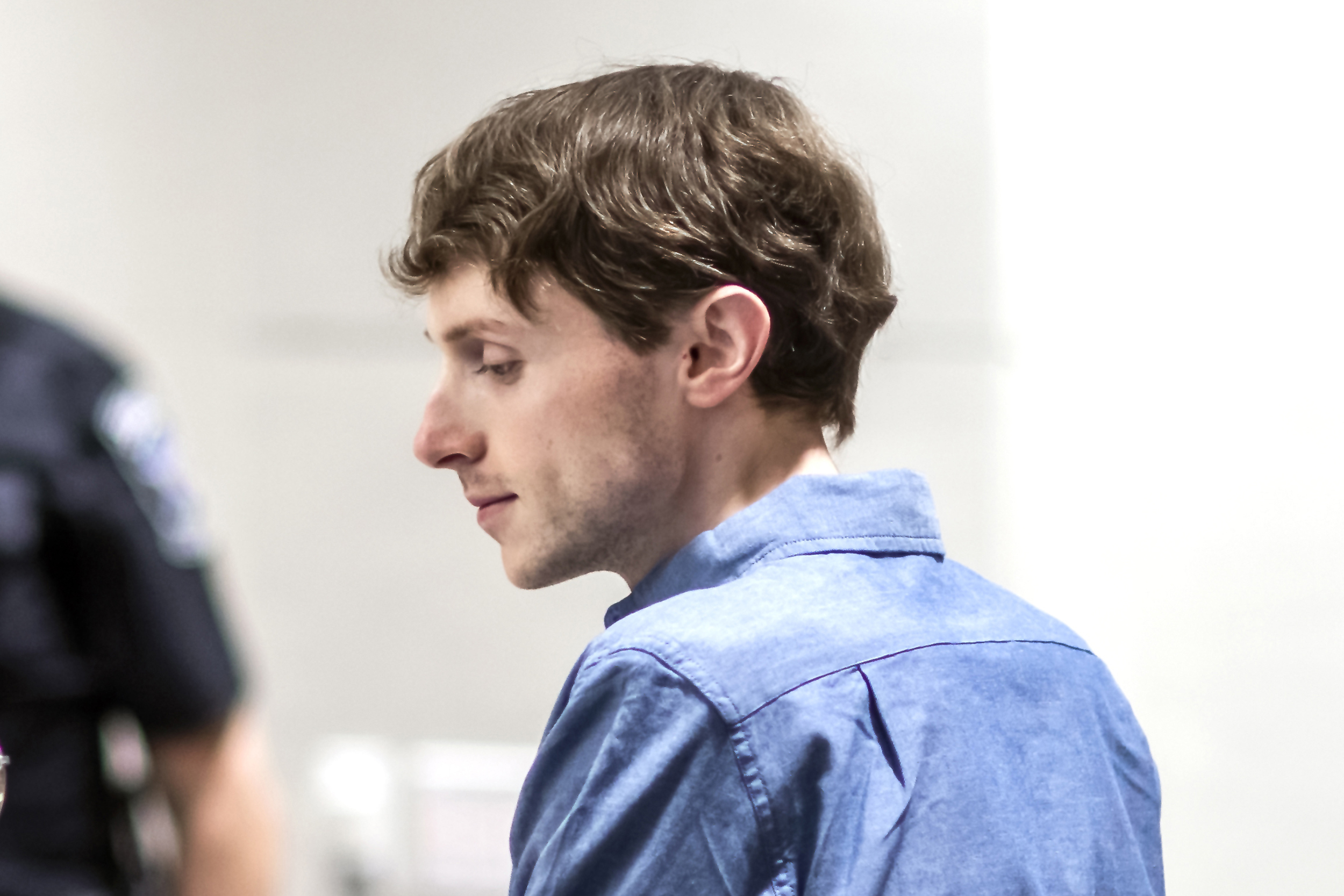 Logan Clegg talks with defense attorney Maya Dominguez at his trial at Merrimack County Superior Court in Concord, New Hampshire, on Oct. 3. On Monday, Clegg was found guilty of the murders of a retired couple in April 2022.