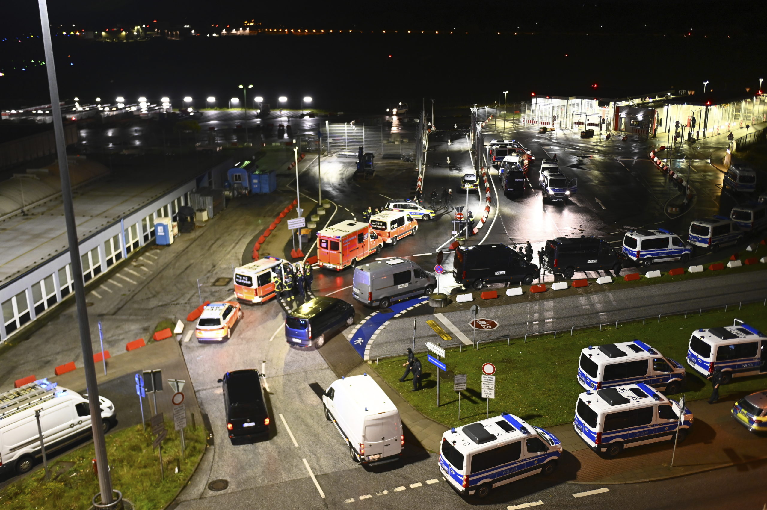 Police vehicles and ambulances arrive at the scene of a security breach at the Hamburg Airport Saturday in Hamburg, Germany.