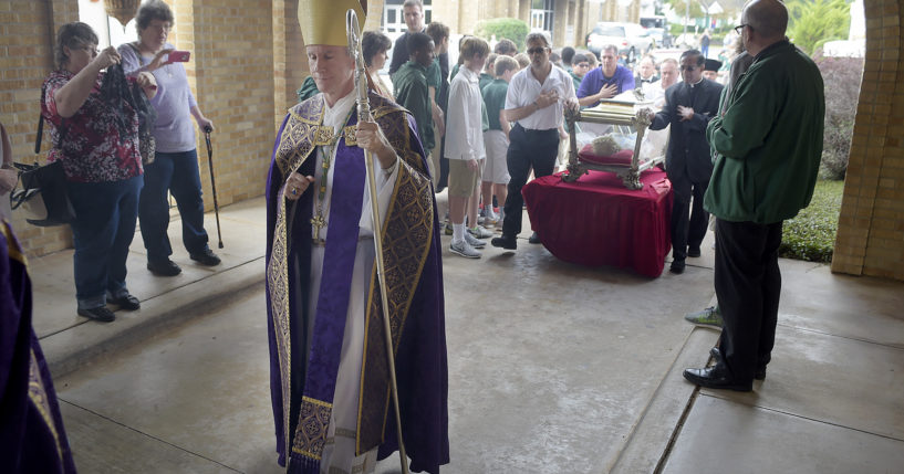 Bishop Joseph Strickland walks in front of a reliquary bearing the bones of Saint Maria Goretti, dubbed “The Little Saint of Great Mercy,” into the sanctuary at Cathedral of the Immaculate Conception in Tyler, Texas, on Nov. 2, 2015.