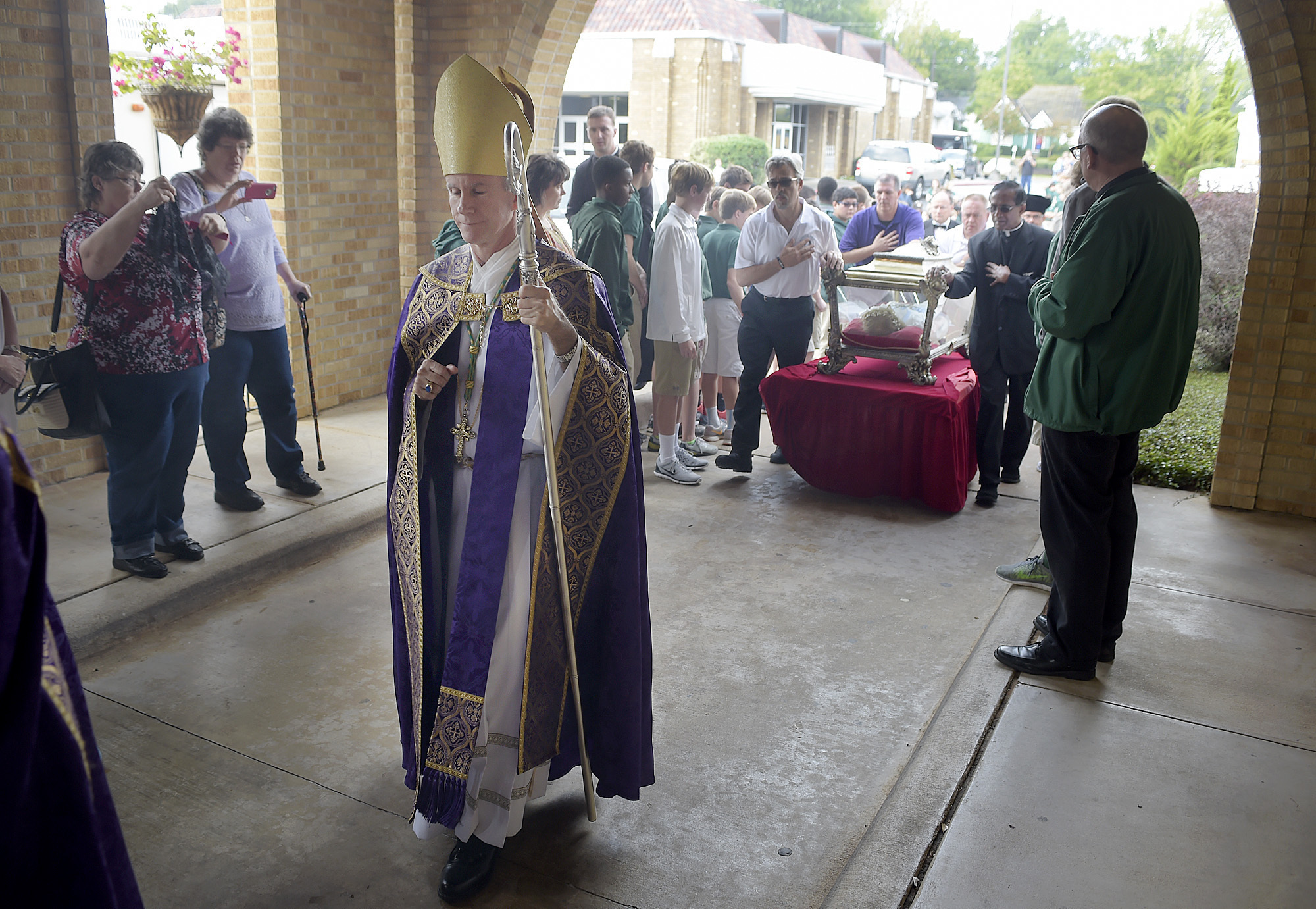 Bishop Joseph Strickland walks in front of a reliquary bearing the bones of Saint Maria Goretti, dubbed “The Little Saint of Great Mercy,” into the sanctuary at Cathedral of the Immaculate Conception in Tyler, Texas, on Nov. 2, 2015.