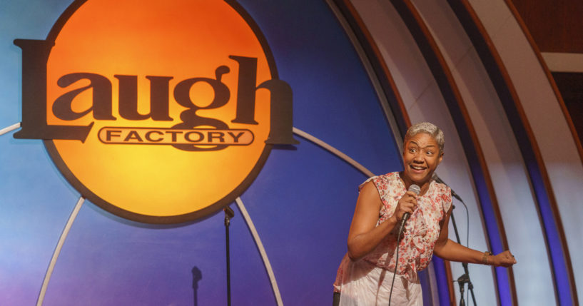 Stand-up comedian and actress Tiffany Haddish entertains guests at Laugh Factory Hollywood, during its free Thanksgiving Day meal Thursday in Los Angeles.