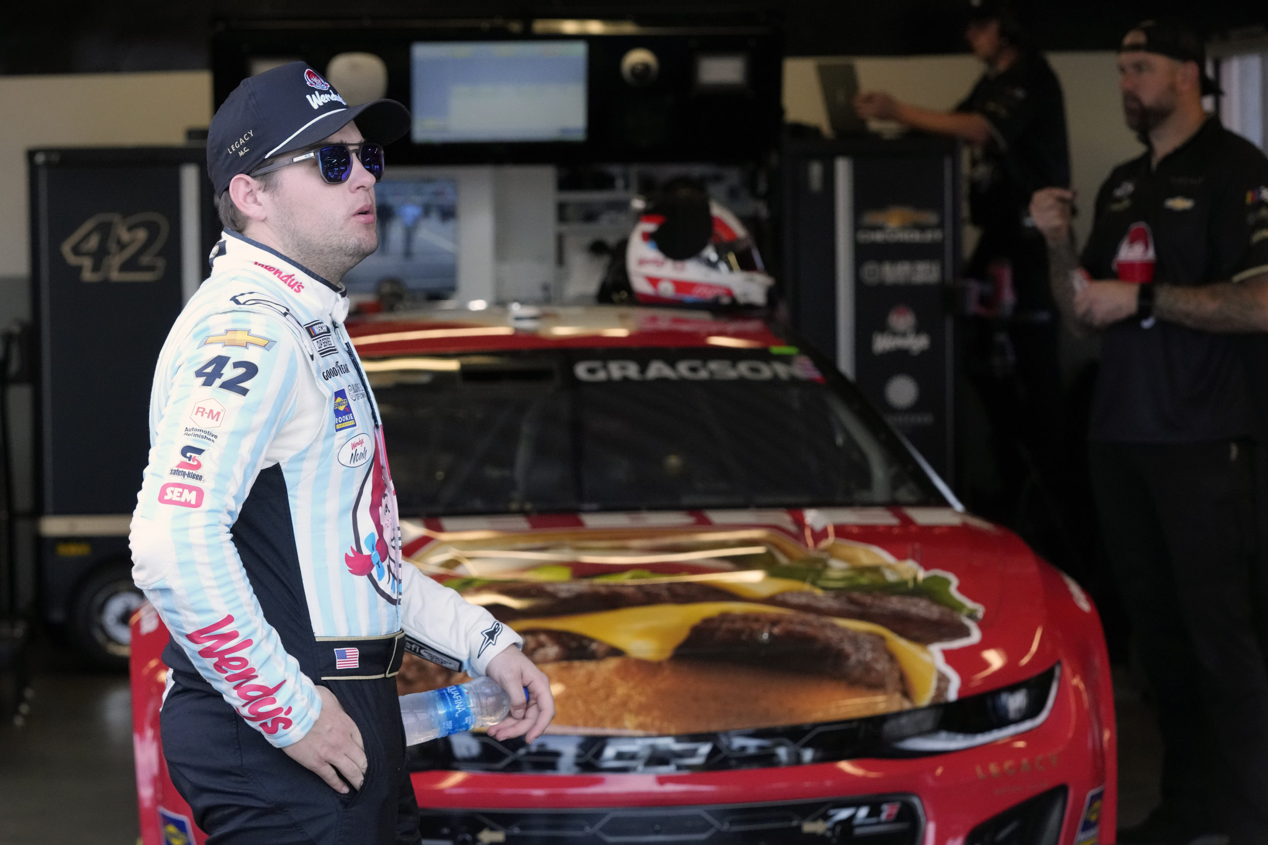 Noah Gragson stands by his car in his garage during a practice session for the NASCAR Daytona 500 auto race at Daytona International Speedway in Daytona Beach, Florida, on Feb. 17.