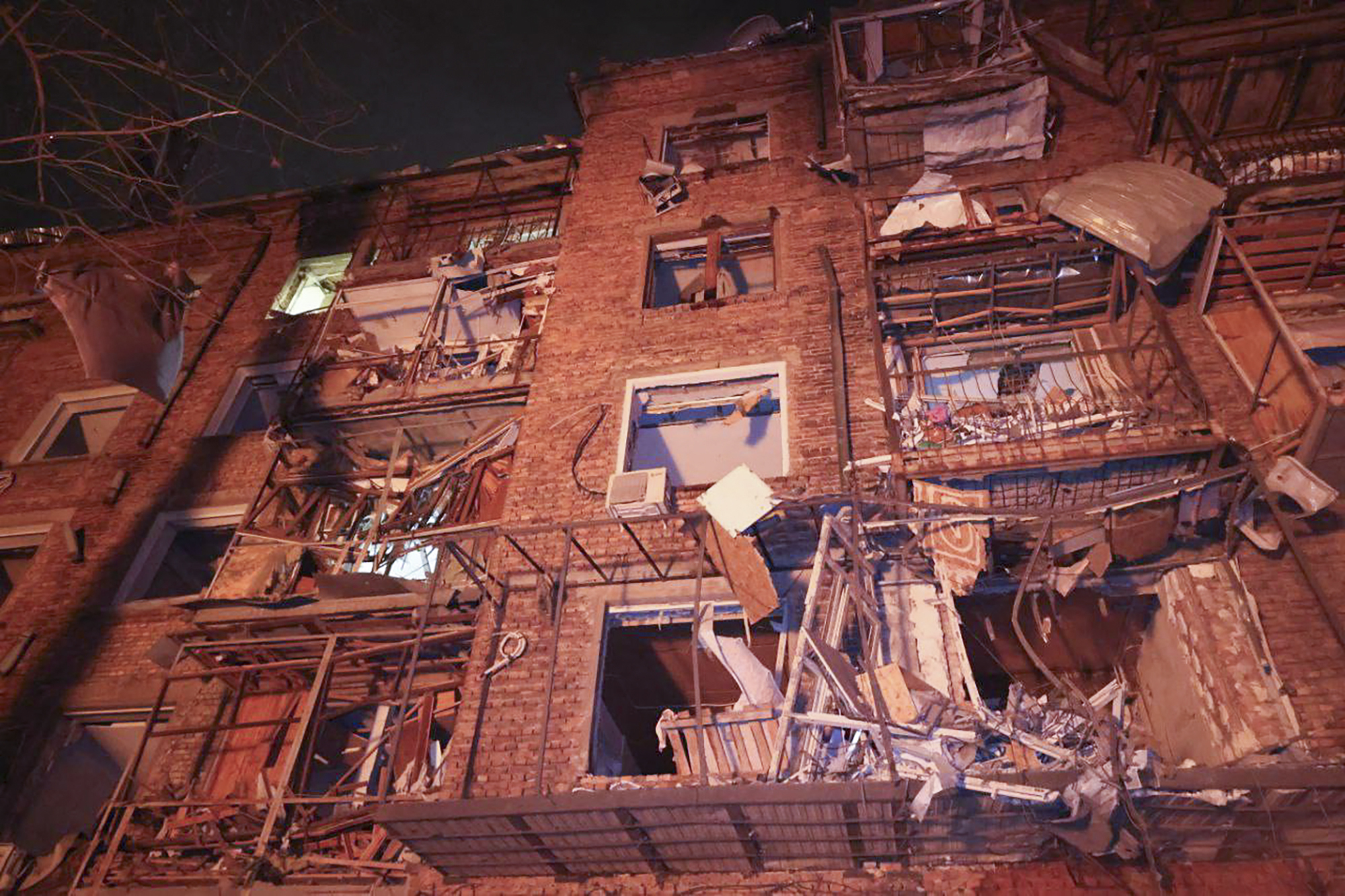 In a photo provided by the Ukrainian Emergency Service, an apartment building in the Ukrainian city of Kharkiv is shown after a devastating Russian missile strike on Saturday.