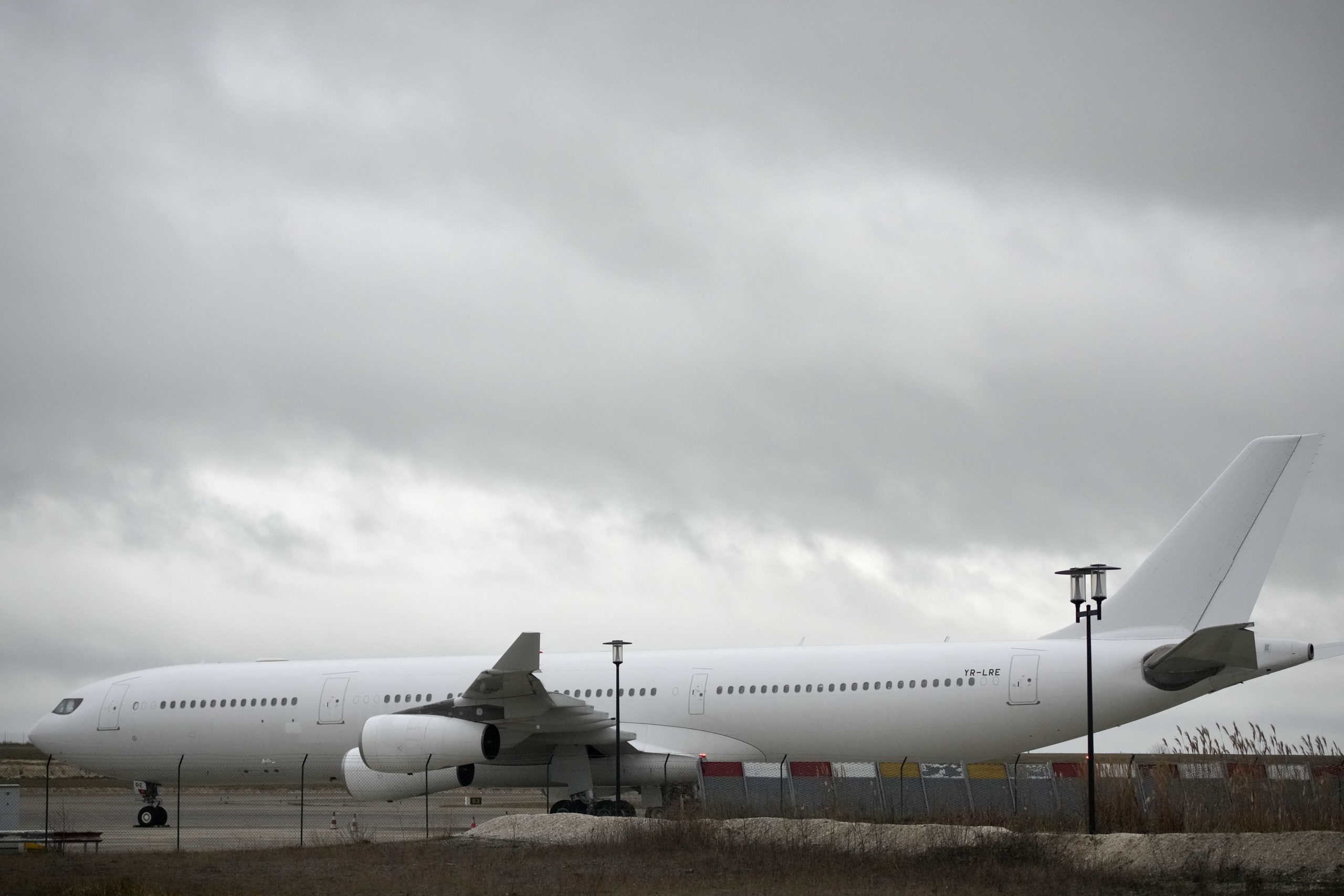 A plane reported to carry some 300 Indian citizens parks at the Vatry airport in France on Saturday.