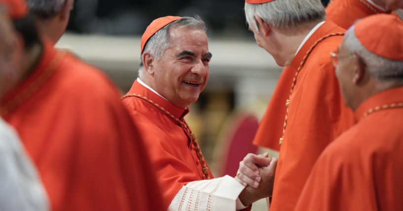 Former Cardinal Angelo Becciu attends a consistory inside St. Peter's Basilica, at the Vatican, on Aug. 27, 2022.