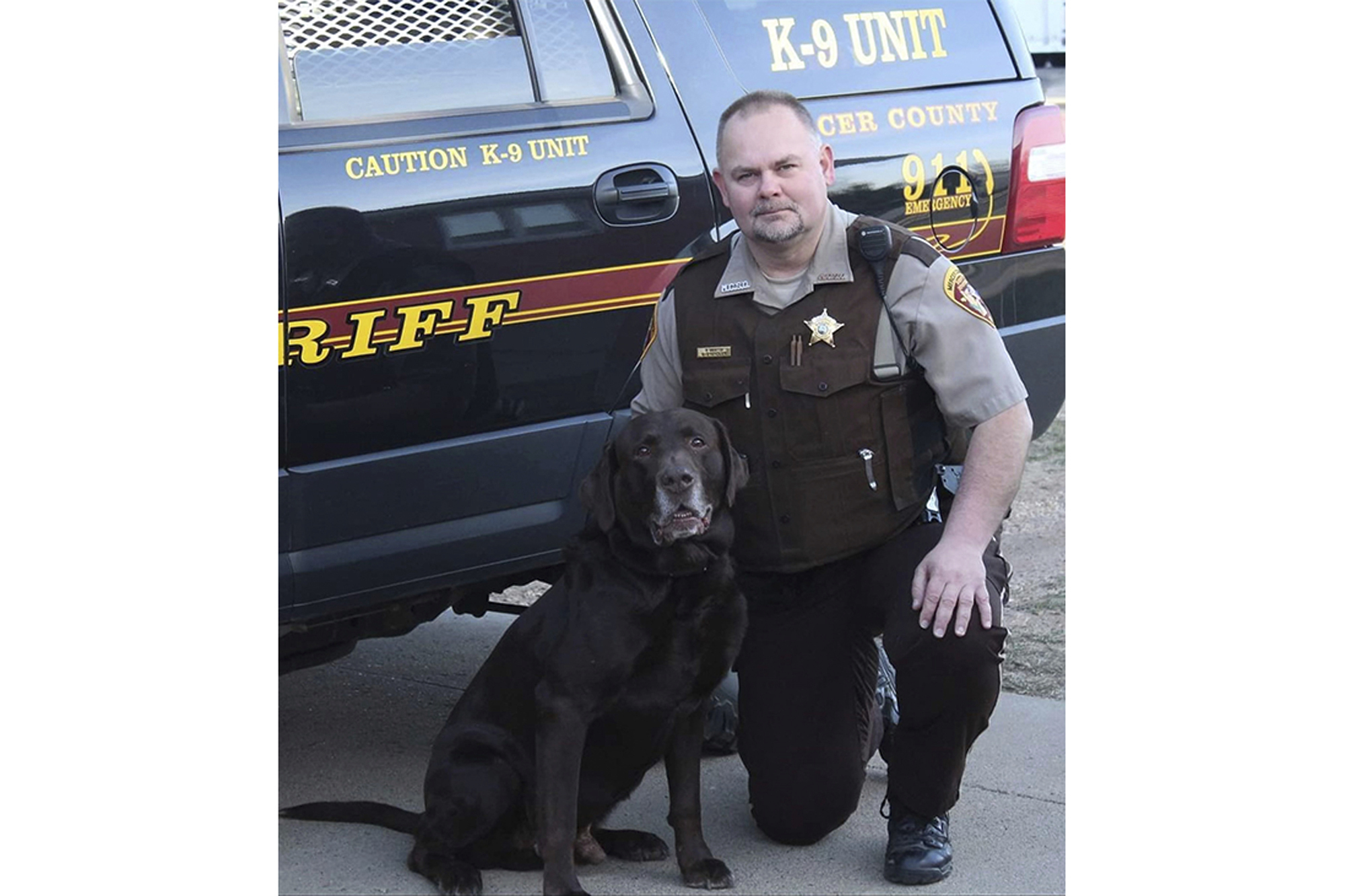 Mercer County Sheriff's Deputy Paul Martin is pictured with his retired K9 Goliath. Martin was killed in a crash on Dec. 6.