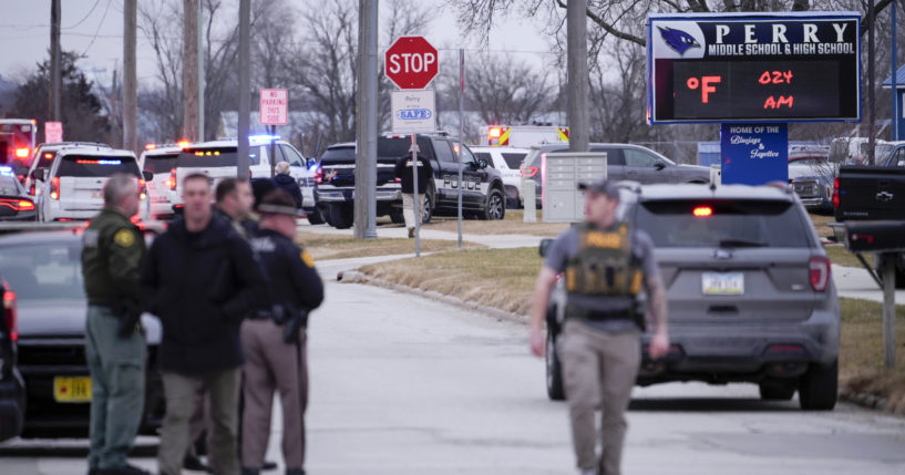 Police respond to Perry High School in Perry, Iowa, on Thursday.