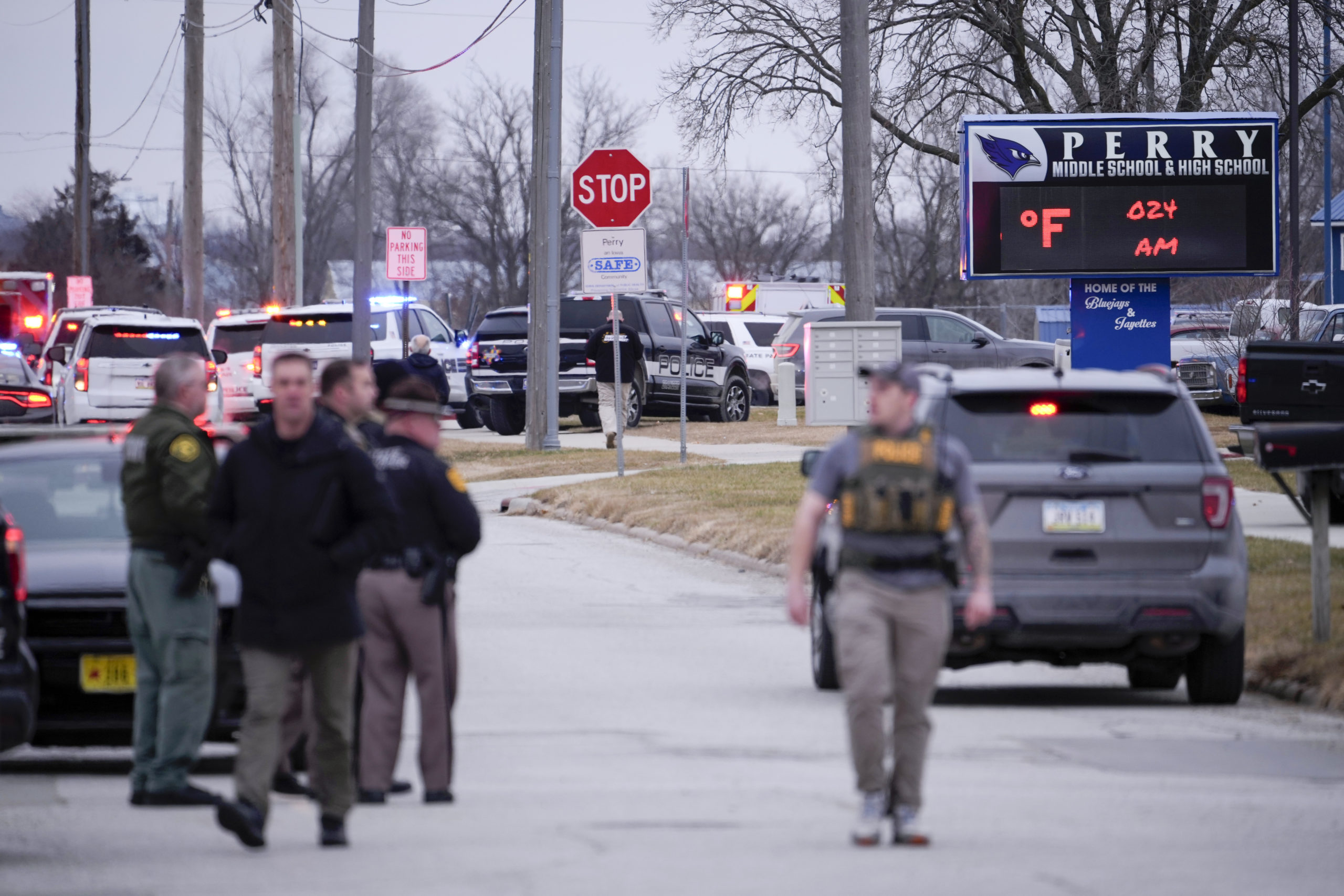 Police respond to Perry High School in Perry, Iowa, on Thursday.