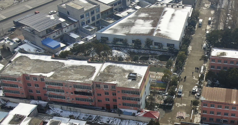 In this photo released by Xinhua News Agency, an aerial drone Saturday shows a dormitory with charred windows after a fire broke out at the Yingcai School in central China's Henan province.