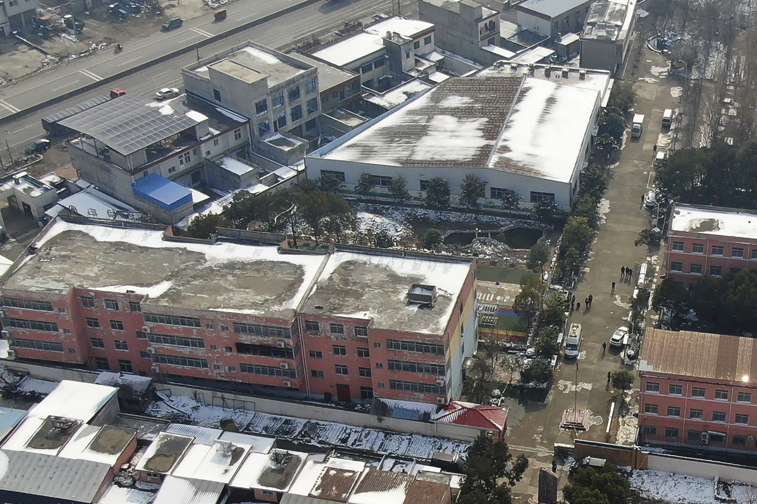 In this photo released by Xinhua News Agency, an aerial drone Saturday shows a dormitory with charred windows after a fire broke out at the Yingcai School in central China's Henan province.