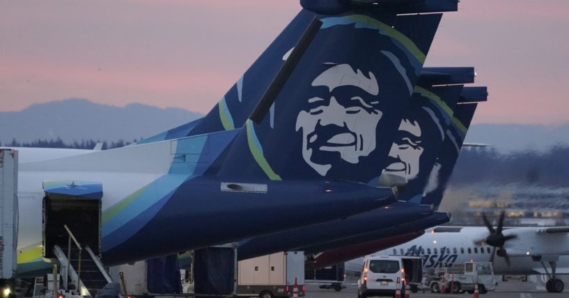 An Alaska Airlines flight made an emergency landing Friday in Oregon after a window and chunk of its fuselage blew out in mid-air, media reports said.