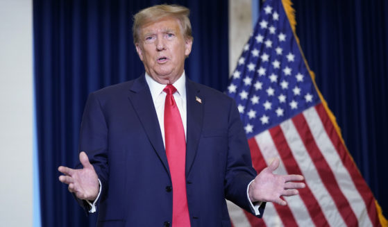 Former President Donald Trump speaks to the media at a Washington hotel Tuesday after attending a hearing before the D.C. Circuit Court of Appeals at the federal courthouse in Washington.