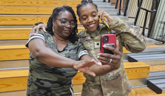 Army Spc. Kennedy Sanders, right, poses for a photo with her mother, Oneida Oliver-Sanders, at a ceremony in Columbus, Georgia, on Aug. 9.