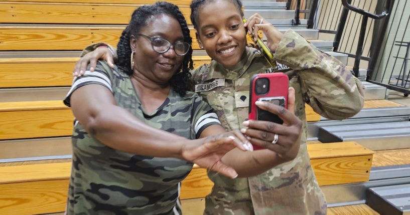 Army Spc. Kennedy Sanders, right, poses for a photo with her mother, Oneida Oliver-Sanders, at a ceremony in Columbus, Georgia, on Aug. 9.