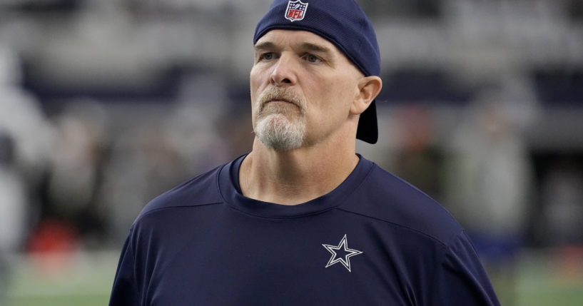 Dallas Cowboys defensive coordinator Dan Quinn watches players warm up for an NFL football game against the Washington Commanders in Arlington, Texas, on Nov. 23.