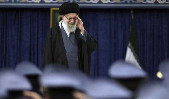 Iranian Supreme Leader Ayatollah Ali Khamenei salutes during a meeting with military staff in Tehran on Monday.