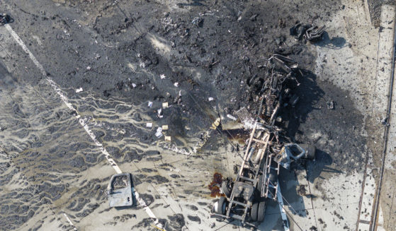 The tractor portion of a big rig is shown in an aerial view Thursday in the Wilmington section of Los Angeles. Several Los Angeles firefighters were injured, two critically, when an explosion occurred as they responded to a truck with pressurized cylinders that were on fire early that day.