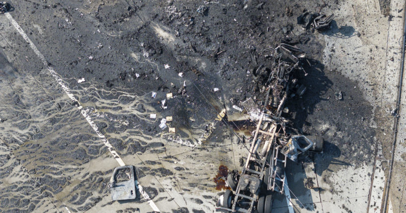 The tractor portion of a big rig is shown in an aerial view Thursday in the Wilmington section of Los Angeles. Several Los Angeles firefighters were injured, two critically, when an explosion occurred as they responded to a truck with pressurized cylinders that were on fire early that day.