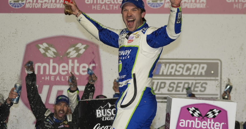 Daniel Suarez celebrates after winning the NASCAR auto race at Atlanta Motor Speedway in Hampton, Georgia, on Sunday.