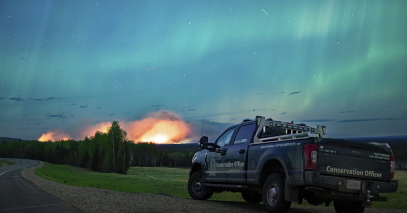 An Aurora Borealis is pictured near Fort Nelson, British Columbia, on Saturday. An intense wildfire could hit a town in western Canada on Monday, based on forecasts of strong winds that have been fueling the out-of-control blaze which has already forced the evacuation of thousands, fire experts and officials warned.