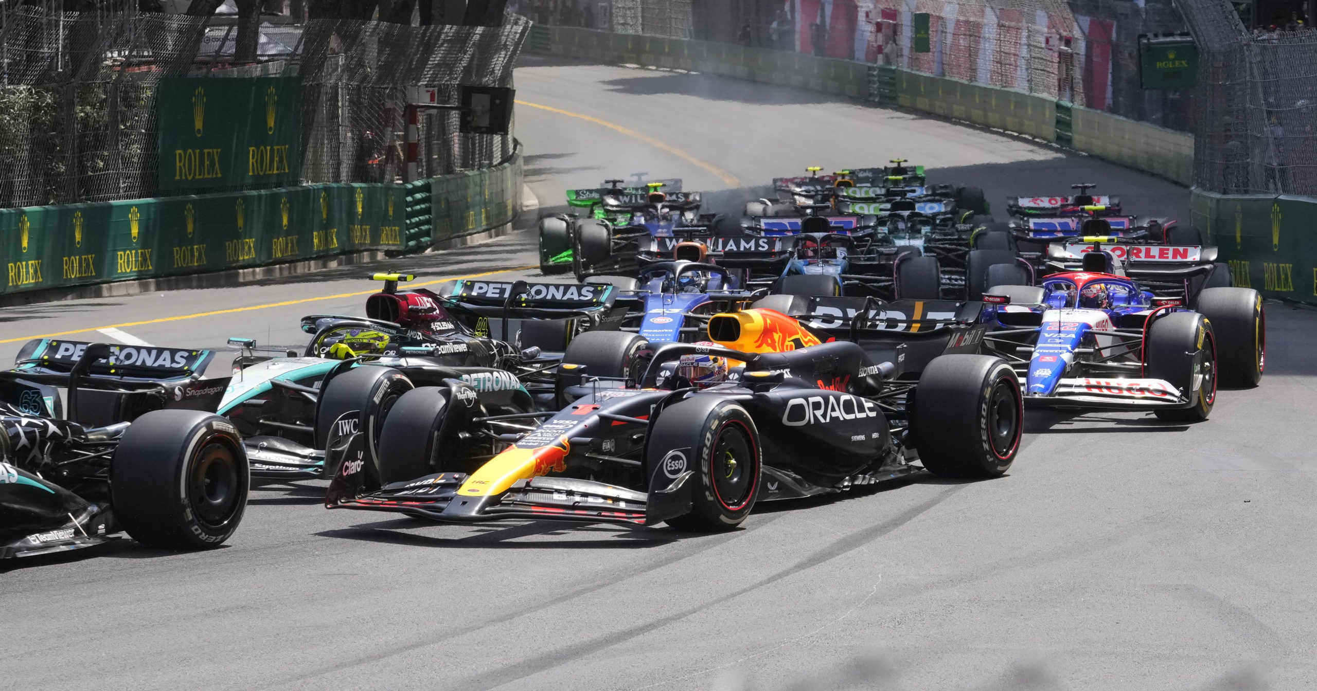 Red Bull driver Max Verstappen of the Netherlands, centre, steers his car during the Formula One Monaco Grand Prix race at the Monaco racetrack, in Monaco, Sunday, May 26, 2024.