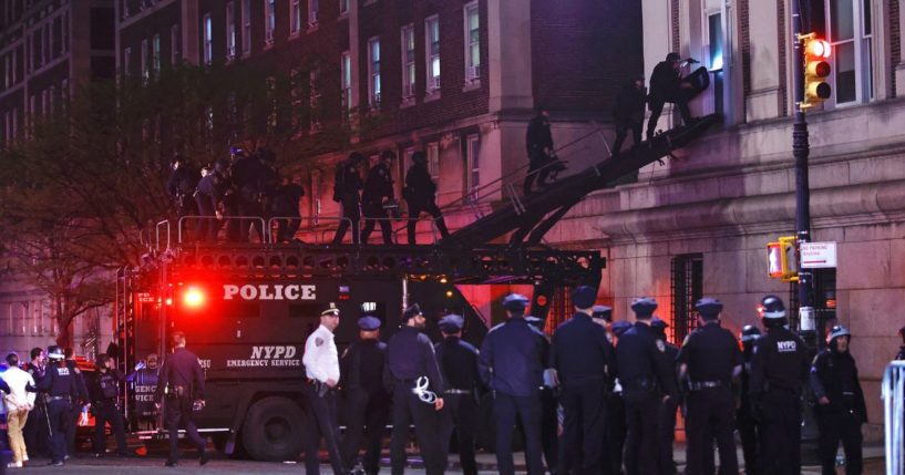 NYPD officers in riot gear enter Hamilton Hall at Columbia University, where pro-Palestinian students had barricaded set up an encampment, in New York City on Tuesday.