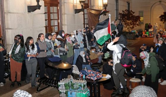 Anti-Israel protesters lock arms to block police from entering Hamilton Hall on the campus of Columbia University in New York City on Tuesday.