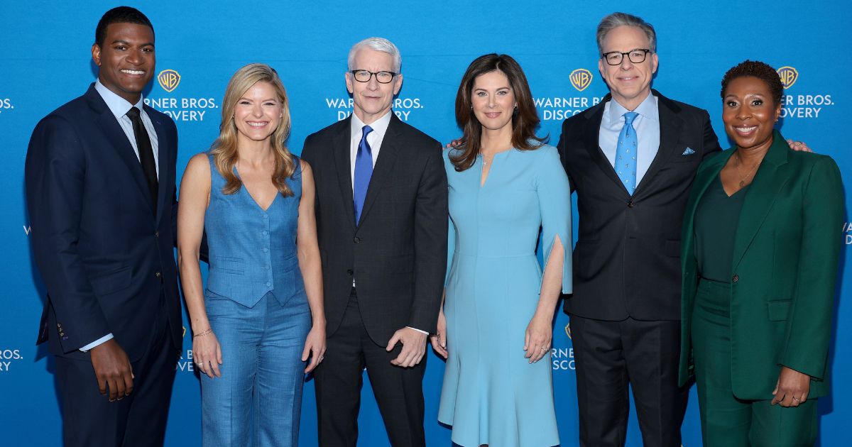 From left, Omar Jimenez, Kate Bolduan, Anderson Cooper, Erin Burnett, Jake Tapper and Audie Cornish attend a Warner Bros. Discovery event in New York on May 15.