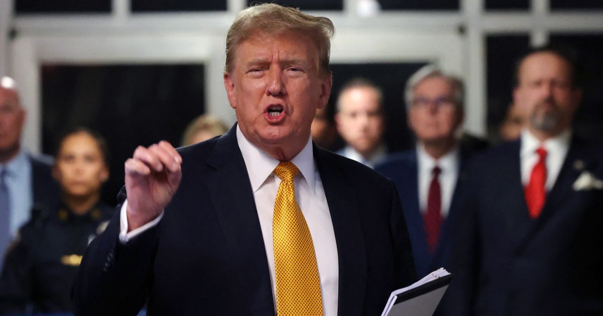 Former President Donald Trump speaks to the media as he returns from a break in his criminal trial at Manhattan Criminal Court in New York City on Tuesday.