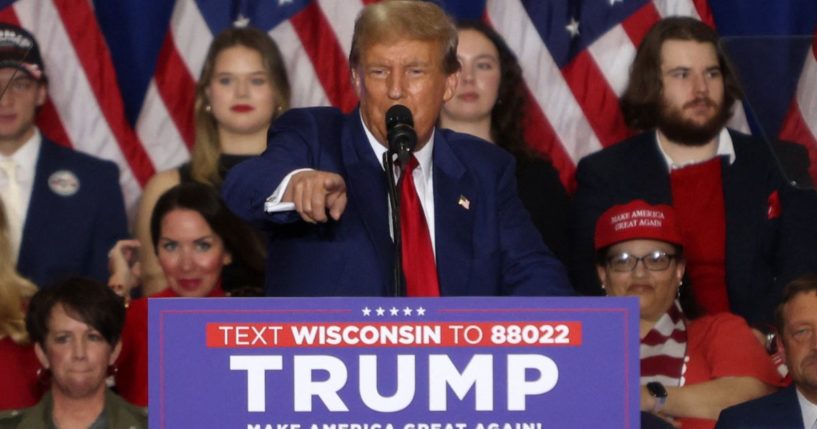 Former President Donald Trump peaks during a campaign rally in Green Bay, Wisconsin, on April 2.