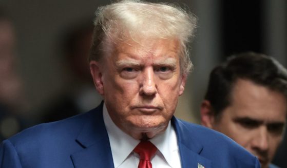 Former President Donald Trump walks to speak to members of the media at the end of the day at his trial at Manhattan Criminal Court in New York City on Monday.